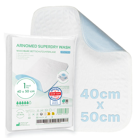 Die ARNOMED SUPERDRY WASH Waschbare Bettschutzunterlage von ARNOWA GmbH, 40x50cm, weiß mit hellblauer Unterseite und Superdry-Technologie. Verpackung mit Produktdetails und Pflegehinweisen auf Deutsch.
