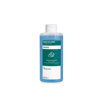 Uma garrafa de 500ml de loção de lavagem Dr. Schumacher DESCOLIND COMFORT WASH da Dr. Schumacher GmbH com tampa branca, líquido azul e um rótulo com alantoína e o logotipo Dr. Schumacher em fundo branco.