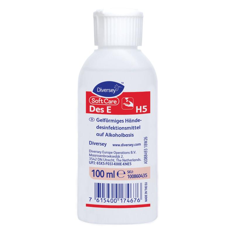 Uma garrafa branca de 500 ml de Soft Care Des E, um desinfetante para as mãos em gel listado pela VAH da Diversey Deutschland GmbH & Co. OHG, com um rótulo alemão vermelho e branco e um código de barras azul na parte inferior.