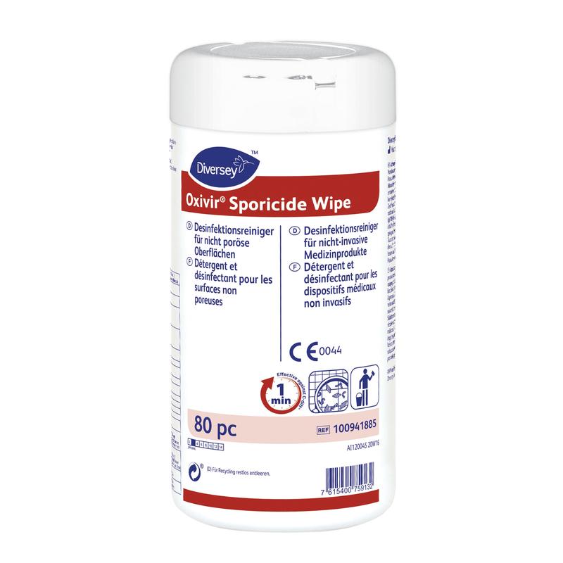 Um recipiente branco de Oxivir Sporicide Wipe, toalhetes descartáveis pré-umedecidos | Lata (80 toalhetes) da Diversey Deutschland GmbH & Co. OHG possui uma rotulagem azul/vermelha, informações multilíngues e símbolos para desinfecção de superfícies e uso de produtos médicos.