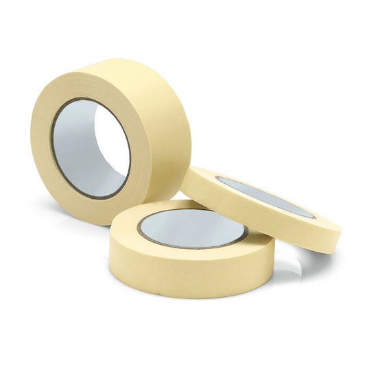 Três rolos de fita de proteção para pintura «Nölle Profi Brush», da Nölle Profi Brush Bürsten- & Pinseltechnik e.K., na cor bege, são apresentados sobre um fundo branco — dois na vertical e um na horizontal — com os núcleos de cartão visíveis, ideais para bordas de pintura precisas e trabalhos profissionais.