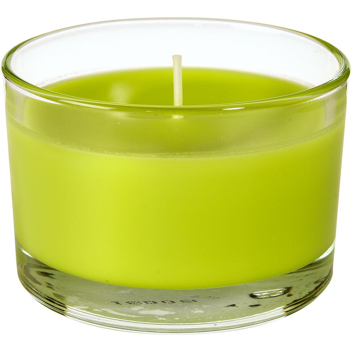 Um copo de vela verde Ibiza (aprox. 18h, 58x85mm) da Duni GmbH com um único pavio está sem uso em um recipiente de vidro transparente - ideal para iluminação ambiente e toques de estilo em qualquer ambiente.