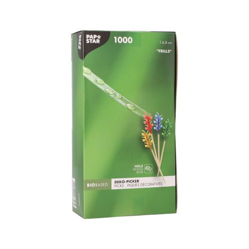 O PAPSTAR 1000 palito decorativo 6,8 cm "Frills" da PAPSTAR GmbH é entregue numa caixa verde com espetos de franja colorida para decoração de mesa e possui uma embalagem que exibe os espetos e uma gota de orvalho sobre a relva em close-up.