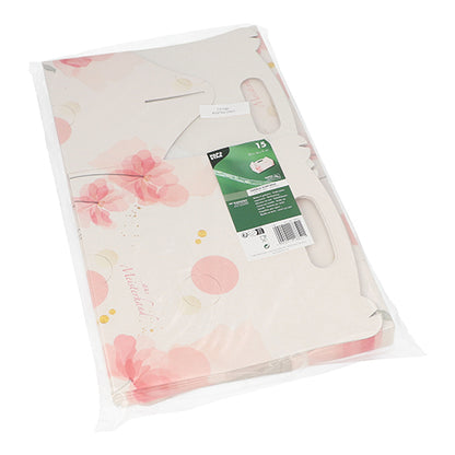 As PAPSTAR 15 caixas de pastelaria, papelão rosa quadrado com alça da PAPSTAR GmbH estão em uma embalagem de plástico transparente com design floral rosa-branco, ideal para o transporte de produtos de pastelaria e possuem um rótulo verde-branco com informações e código de barras.