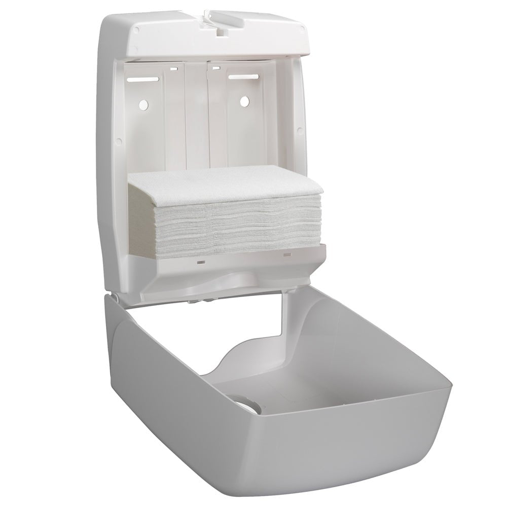 Um dispensador de parede branco está aberto e mostra um monte de toalhas Hostess™ NATURA™ (dobradas, brancas, grandes), da Kimberly-Clark GmbH - ideal para a fácil retirada de toalhas de papel em lavabos públicos. Caixa: 20 pacotes x 84 folhas.