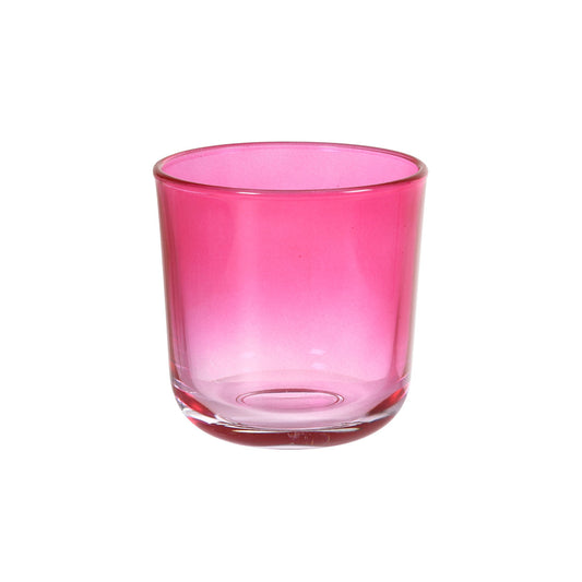 Ein fuchsiafarbener Switch & Shine Kerzenhalter aus Glas von Duni GmbH mit runder Form und stabilem Sockel steht auf weißem Grund.