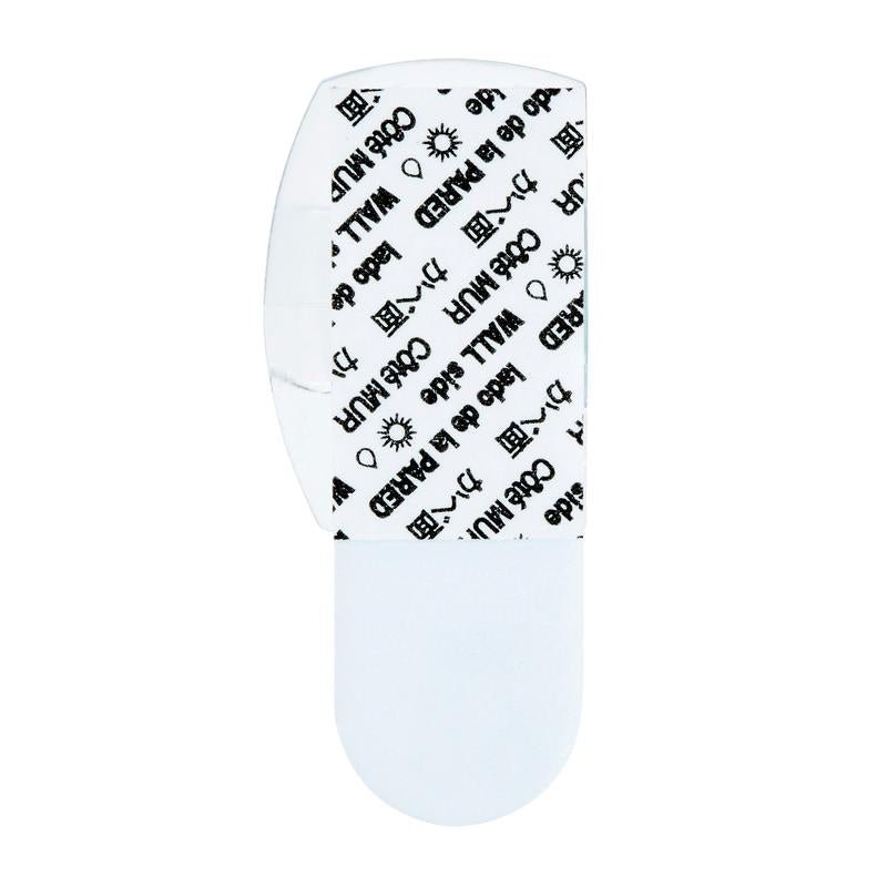 Uma tira adesiva branca dos clipes de luzes externas Command™ da 3M Deutschland GmbH, 17017CLR-AWPU (8 clipes + 10 tiras), com a cobertura removida, libera a almofada e mostra texto preto como clipes para fixação de iluminação exterior.