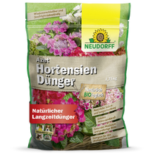Um saco de 1,75 kg de Neudorff Shop Azet HortensienDünger, um fertilizante natural para hortênsias de jardim, com uma embalagem com flores rosa e brancas e texto em alemão.