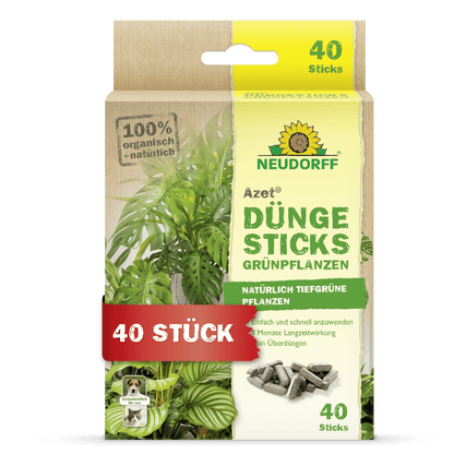 Os Azet Düngesticks para plantas verdes da Neudorff Shop são entregues numa caixa com uma imagem de planta, uma informação sobre o produto e uma etiqueta "40 Peças". A embalagem destaca os ingredientes 100% biológicos, naturais e a tecnologia de depósito de nutrientes.