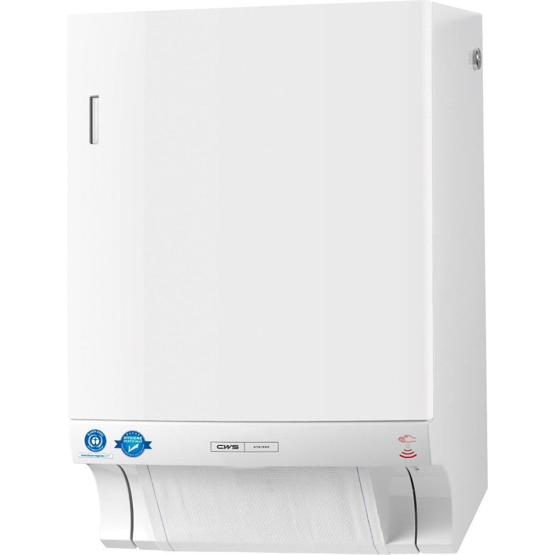 O distribuidor de toalhas de tecido CWS ParadiseLine Dry Slim Non-Touch (branco, 1 unidade) é um distribuidor de parede para a distribuição higiénica de toalhas, com uma placa de fixação visível e um autocolante de certificação na parte inferior esquerda do painel frontal.