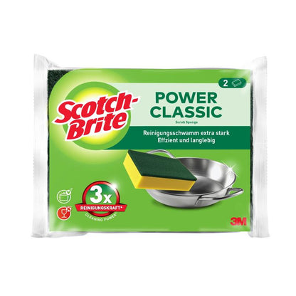Um pacote de esponjas de limpeza Scotch-Brite® Classic da 3M Deutschland GmbH mostra duas esponjas, uma etiqueta em alemão, uma marca de produto, uma esponja limpando uma panela de metal e a indicação "3x força de limpeza".