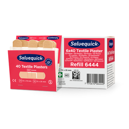 Uma caixa aberta de Orkla Wound Care AB Textilgesso, 40 unid./Recarga está ao lado de uma embalagem fechada (6 peças), onde vários pensos bege para cuidados de feridas são visíveis.