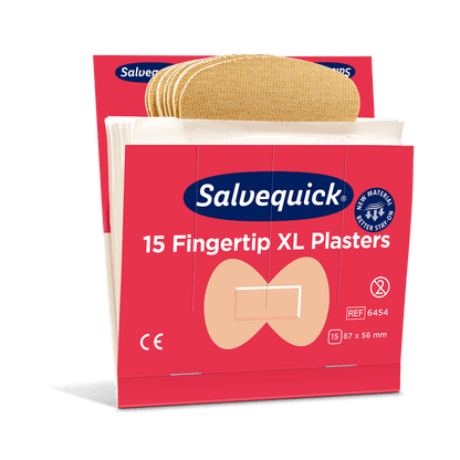 Uma embalagem de Orkla Wound Care AB XL Pensos de Tecido para Pontas dos Dedos (15 unidades/Mina | embalagem, 6 unidades) com pensos bege flexíveis numa caixa vermelha e branca, cada penso com 87 x 56 mm de tamanho.