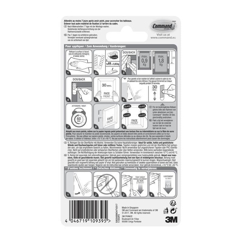 A parte de trás da embalagem das Pequenas Tiras Command™ para Montagem de Quadros S 17202 da 3M Deutschland GmbH mostra instruções ilustradas de montagem e remoção, advertências de segurança, informações do produto, código de barras e detalhes da empresa em vários idiomas.