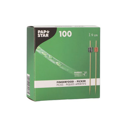 A caixa verde da PAPSTAR GmbH contém 100 palitos para fingerfood, cada um com 9 cm de comprimento, com pontas pretas e vermelhas - perfeito como decoração de quadro-negro para a sua próxima festa.
