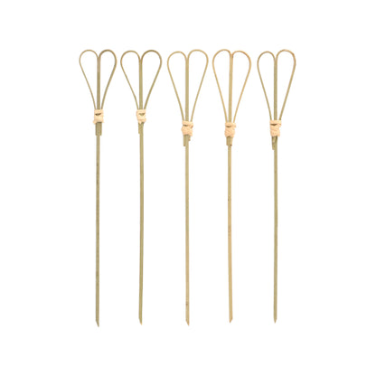 Cinco PAPSTAR 100 Fingerfood - Espetos da PAPSTAR GmbH com topos de laço estão enfileirados diante de um fundo branco e são ideais como palitos de fingerfood elegantes para servir.