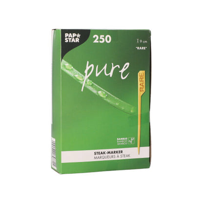 O PAPSTAR 250 marcador de bife de 9 cm da PAPSTAR GmbH é entregue numa caixa verde e branca. A embalagem contém um marcador amarelo "RARE" e gráficos de folha e gota de água, concebidos para cozinhas de restaurantes profissionais.
