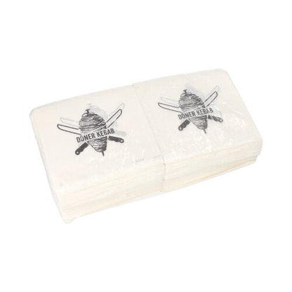Um conjunto de embalagens de Kebabs Döner PAPSTAR (16x16 cm, à prova de gordura), cada uma com espeto de döner e facas cruzadas como nos guardanapos, embaladas em película retrátil (1000 unidades) da PAPSTAR GmbH.