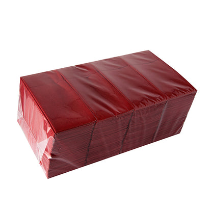 Uma pilha de sacos de talheres Starpak 480 de material Airlaid (40x33 cm, com dobra para talheres), higienicamente embalados em película transparente, apresentados sobre fundo branco.