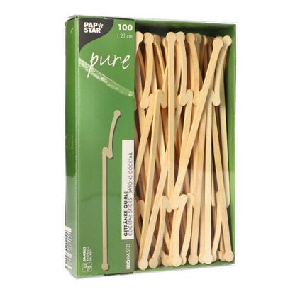Uma caixa verde com a inscrição "PAPSTAR pure" da PAPSTAR GmbH contém 100 mexedores de bebidas de bambu com comprimento de 12 cm cada. Os mexedores biodegradáveis são visíveis através de uma janela na frente da embalagem.