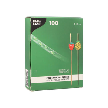 Uma caixa verde com a inscrição "PAPSTAR 100 Fingerfood - Picker" da PAPSTAR GmbH contém 100 palitos com um comprimento de 12 cm cada. Na caixa há duas frutas e uma informação do produto em vários idiomas.