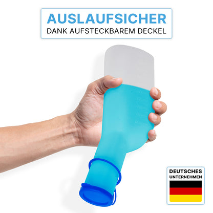 Uma mão segura a garrafa de urina ARNOMED ECO para homens da ARNOWA GmbH com tampa transparente e higiênica; em cima, o texto em alemão destaca o design à prova de vazamento, no canto inferior direito o logotipo da ARNOWA com a bandeira alemã é visível.