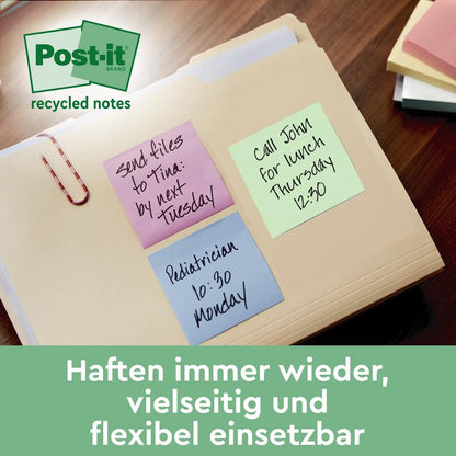 Uma pasta com três notas de Post-it® Recycling (38 mm x 51 mm, 100% PEFC da 3M Deutschland GmbH): uma nota roxa com a inscrição "Enviar arquivos para Tina: até terça-feira", uma nota azul com a inscrição "Pediatra segunda-feira 10:30" e uma nota verde para "Almoço com John quinta-feira 12:30".