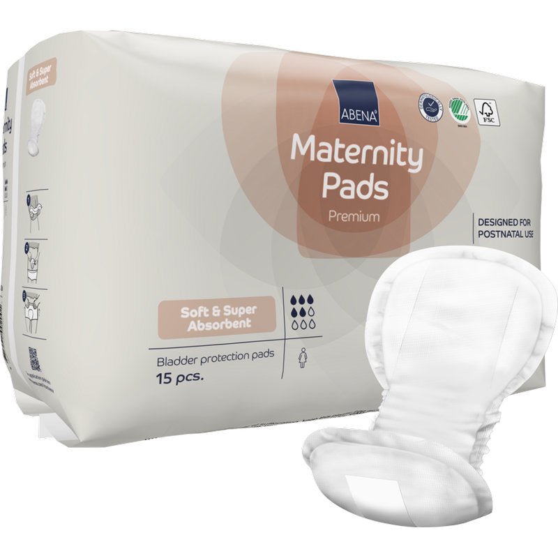 Uma embalagem de ABENA Maternity Pad, Premium (15 unidades) da Abena Re-Seller GmbH oferece pensos suaves e super absorventes, desenvolvidos para uso pós-parto - pensos ideais para conforto máximo após o nascimento, com um penso aberto ilustrado na frente.
