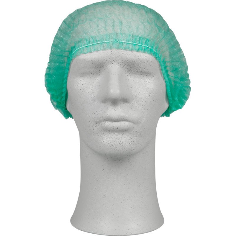 Uma cabeça de manequim branca usa uma touca verde, PP da Abena Re-Seller GmbH. Estas toucas descartáveis de bufalo oferecem proteção higiênica e cobrem completamente a cabeça - ideal para uso em instalações médicas.