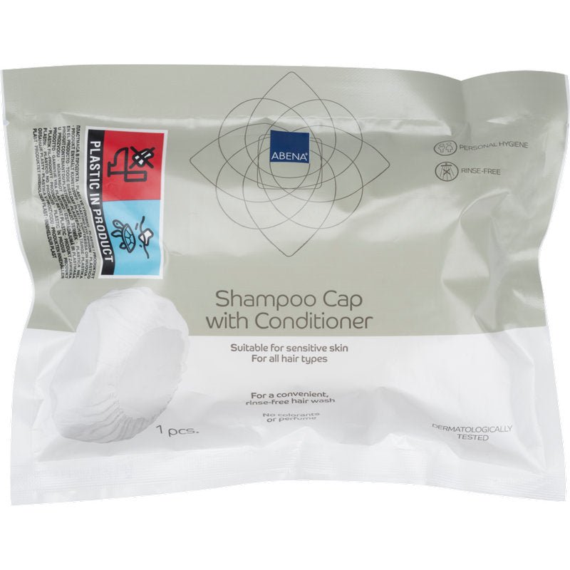 Um pacote selado da Abena Re-Seller GmbH contém uma touca de champô branca (ø 32 cm), testada dermatologicamente, adequada para pele sensível e todos os tipos de cabelo - ideal para uso sem enxaguar (lavar o cabelo sem água).
