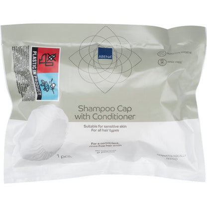 Um pacote selado da Abena Re-Seller GmbH contém uma touca de champô branca (ø 32 cm), testada dermatologicamente, adequada para pele sensível e todos os tipos de cabelo - ideal para uso sem enxaguar (lavar o cabelo sem água).
