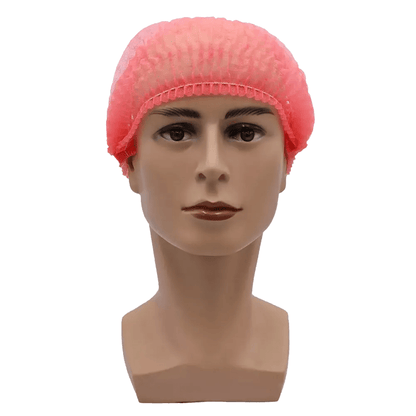 Uma cabeça de manequim com uma touca rosa AMPri MED-COMFORT Klipphaube 52 cm da AMPri Handelsgesellschaft mbH mostra uma expressão facial neutra. A touca feita de polipropileno oferece proteção higiênica com seu ajuste elástico seguro contra um fundo branco simples.