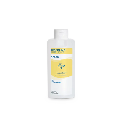 Uma garrafa plástica branca de 500 ml da Dr. Schumacher GmbH Descolind Pure Light Cream, sem perfume para pele sensível, tem um rótulo amarelo com letras azuis e é fotografada contra um fundo branco simples.