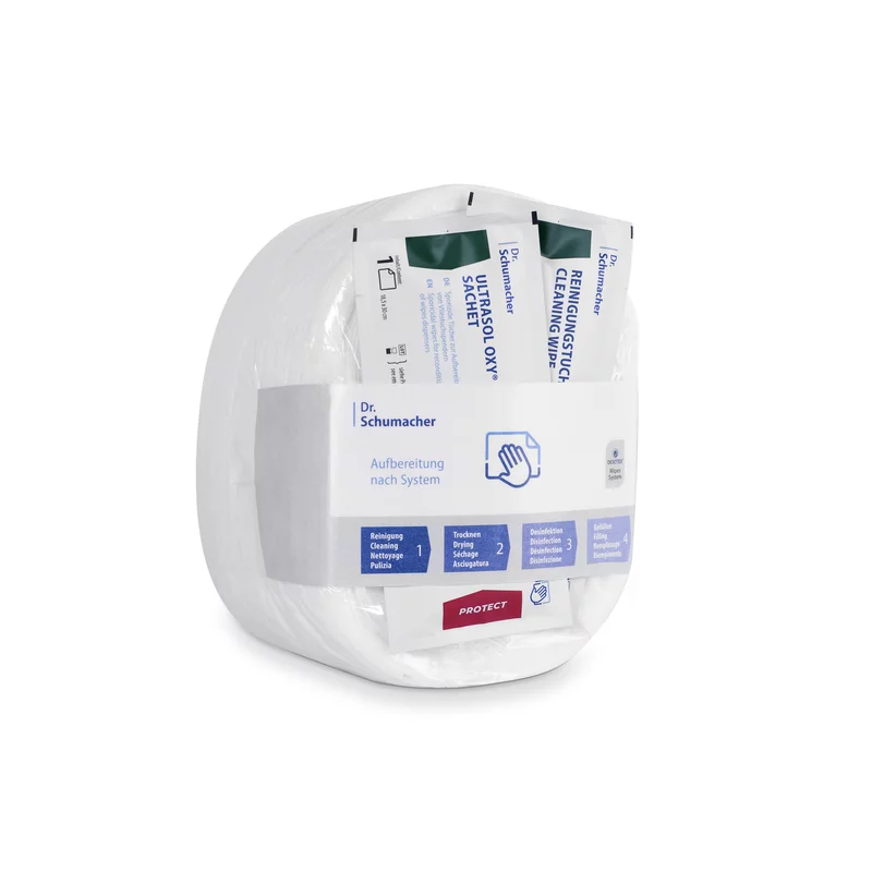 Uma embalagem de toalhetes de tecido não tecido Eco Wipes da Dr. Schumacher GmbH para desinfeção de superfícies, com toalhetes embalados individualmente num recipiente de plástico transparente e arredondado, rotulado com informações sobre o produto e instruções de uso.