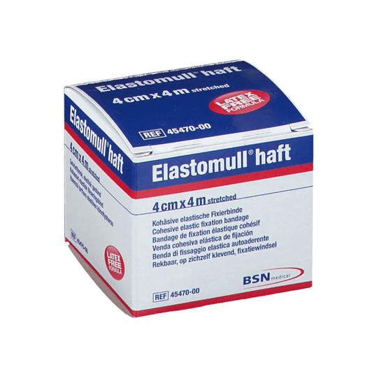 Uma caixa de BSN Elastomull® haft, uma ligadura elástica de fixação com polímero sem látex. A embalagem é branca com texto a azul e vermelho; as dimensões indicadas, quando esticada, são de 4 cm x 4 m; etiqueta da BSN Medical GmbH.