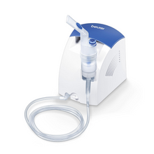 O Beurer Inalador IH 26 da Beurer GmbH é um nebulizador de mesa azul e branco com bocal, copo de medicamento transparente e tubo longo - ideal para tratamento de asma ou como alternativa ao duche nasal.