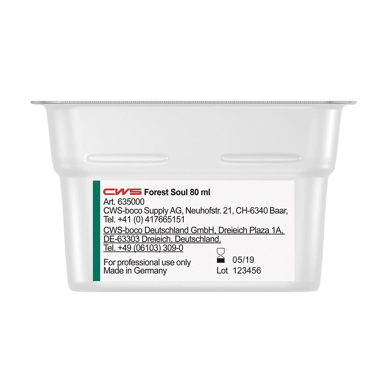 Um recipiente retangular branco com a inscrição "CWS ParadiseLine Fragrância para Casa de Banho para Dispensador de Fragrâncias Paradise Air Bar" da CWS mostra em uma etiqueta branca informações de produto e empresa, dados de contato, a data de fabricação (05/19) e o número do lote (123456).