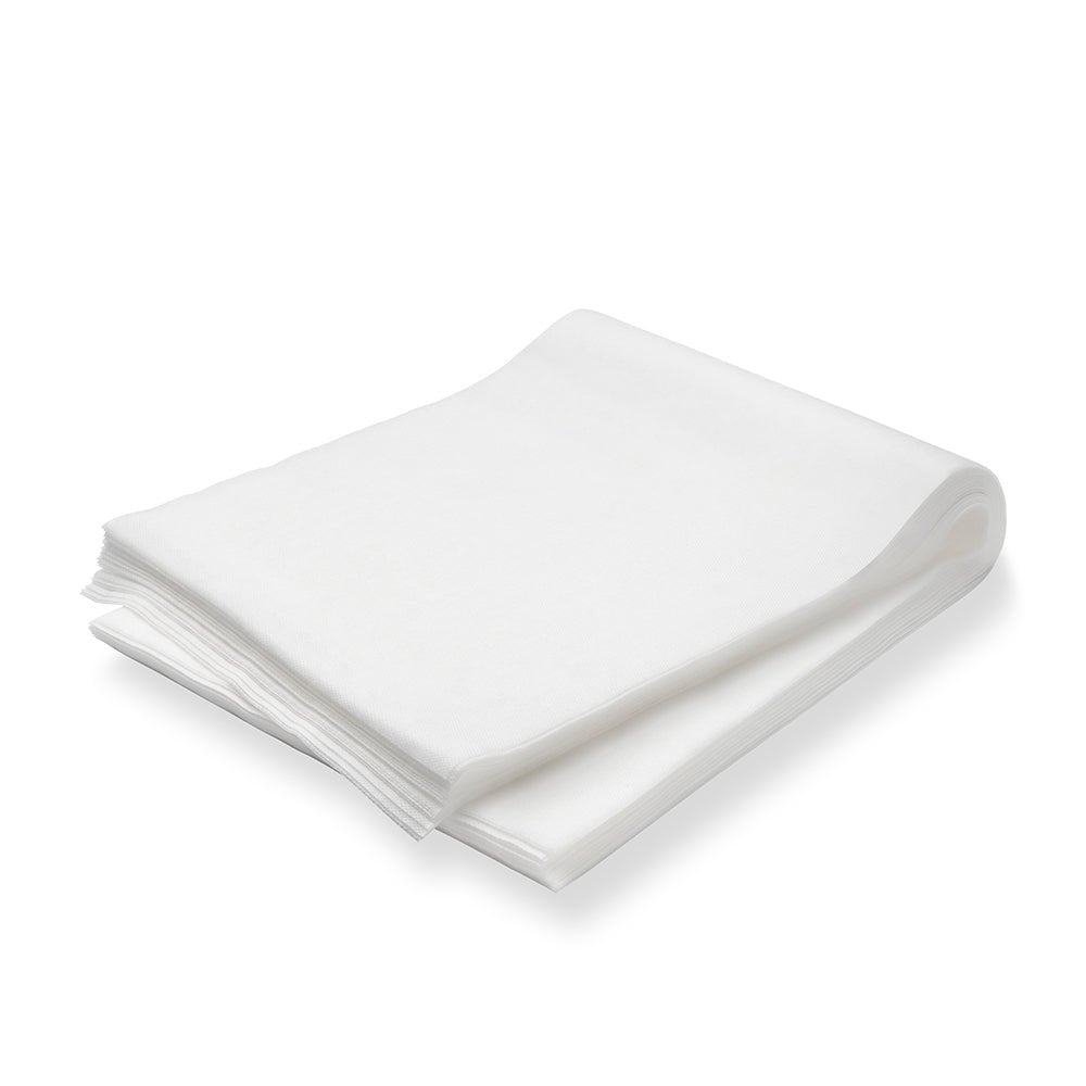 Um pacote de 100 panos de pó TASKI (60 x 25 cm, embebidos em óleo) da Diversey Deutschland GmbH & Co. OHG está empilhado ordenadamente sobre uma superfície branca - ideal para a manutenção diária e remoção de pó em pisos revestidos e não revestidos.