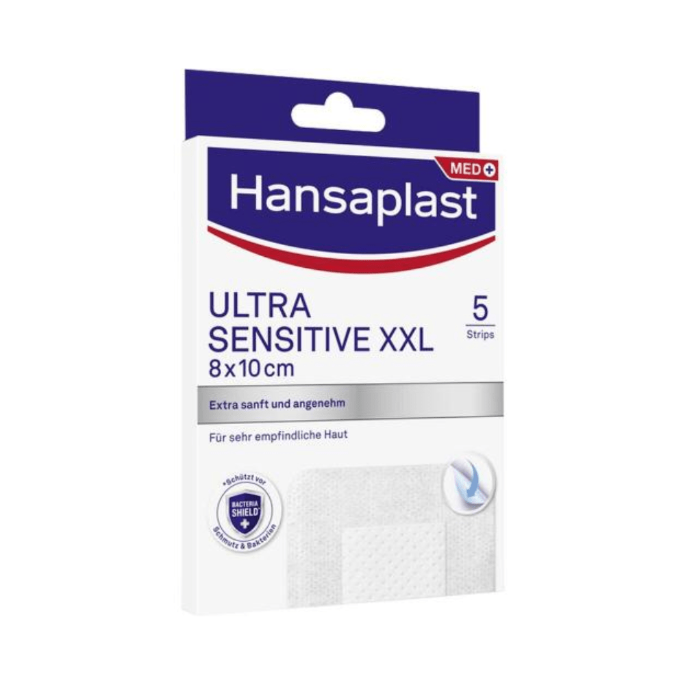 Uma imagem de um Beiersdorf AG Hansaplast Sensitive XXL, especialmente amigável para a pele 8 x 10 cm | Caixa de embalagem (5 peças). As tiras são projetadas para pele muito sensível. A caixa predominantemente branca e azul contém texto em alemão e inglês.