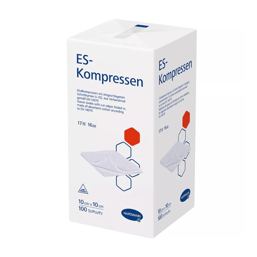 Uma caixa branca de compressas ES da Hartmann, 17 camadas, 16 vezes, não estéril da Paul Hartmann AG mostra informações do produto e diagramas de dobra de compressão. A caixa está rotulada em vermelho e azul e indica o tamanho de 10 cm.