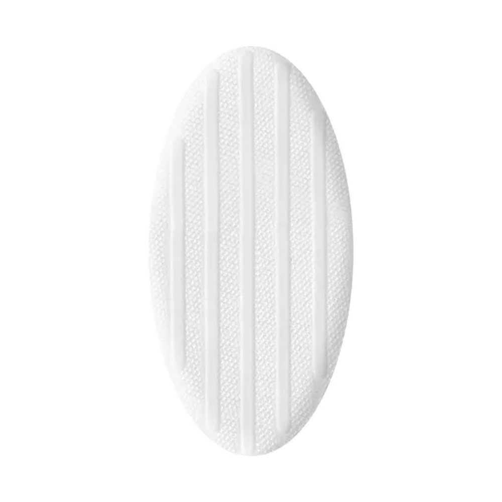 Um tapete de borracha oval branco com linhas texturizadas em relevo para antiderrapagem, adequado para terapia úmida de feridas, isolado sobre fundo branco. Assemelha-se à cobertura de ferida Hartmann HydroClean® da Paul Hartmann AG.