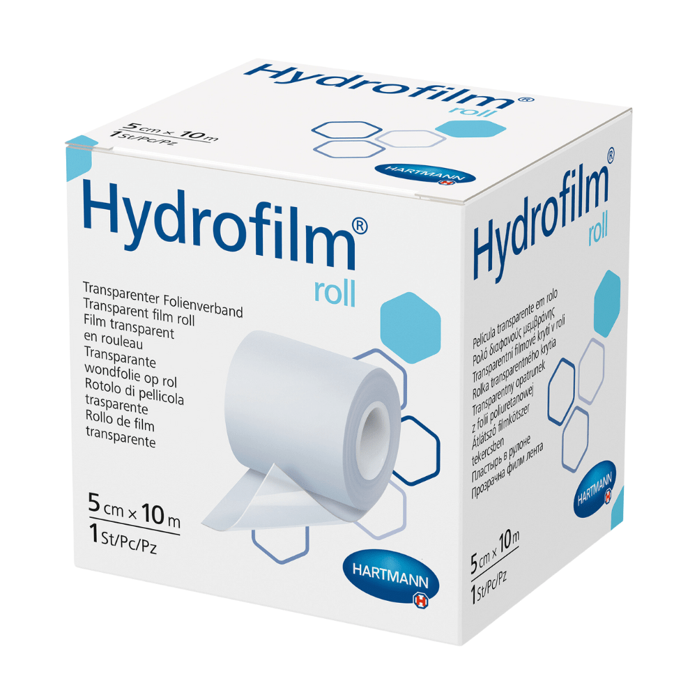 Uma caixa de Hartmann Hydrofilm®-Rolle da Paul Hartmann AG, um curativo de filme transparente. A embalagem é predominantemente branca e azul-clara e mostra o nome do produto, imagens de aplicação e informações de tamanho.