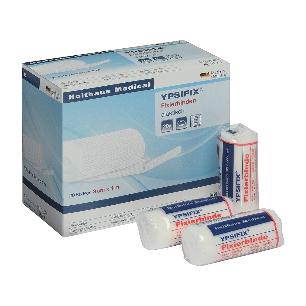 Imagem de uma caixa de faixas de fixação Holthaus Ypsifix® da Holthaus Medical GmbH & Co. KG, 8 cm x 4 m. A caixa contém 20 faixas individuais. Três faixas individuais estão ilustradas na frente da caixa; duas estão embaladas em plástico, enquanto uma está parcialmente desembrulhada. Fabricado na Alemanha, perfeito para fixar coberturas de feridas.