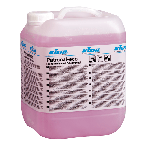 Grande recipiente transparente com alça, cheio de líquido rosa. A etiqueta mostra "Kiehl Patronal-eco Limpeza Sanitária com Fórmula de Proteção" de Johannes Kiehl KG, lista instruções multilíngues e enfatiza a limpeza completa.
