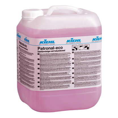 Grande recipiente transparente com alça, cheio de líquido rosa. A etiqueta mostra "Kiehl Patronal-eco Limpeza Sanitária com Fórmula de Proteção" de Johannes Kiehl KG, lista instruções multilíngues e enfatiza a limpeza completa.