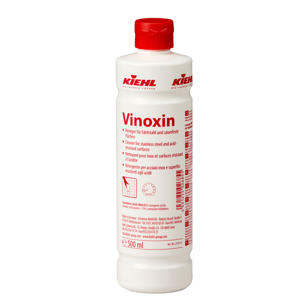 Garrafa branca de 500 ml Johannes Kiehl KG Vinoxin Limpeza para aço inoxidável e superfícies resistentes a ácidos, com tampa vermelha e rótulo com instruções de uso e informações do produto. Disponível em caixas com 12 garrafas.
