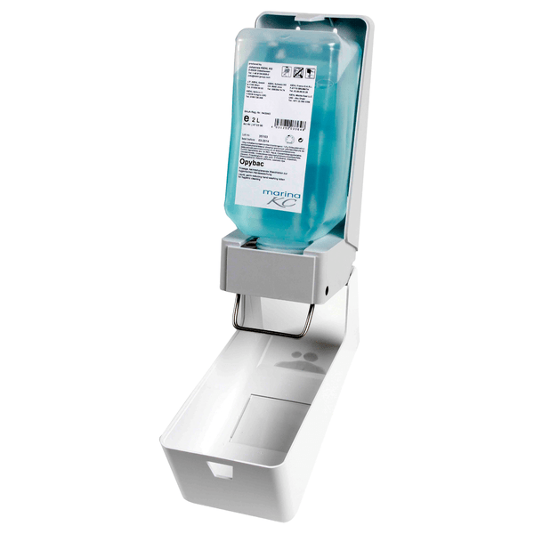 O dispensador de sabonete e creme Kiehl ManoDos-soft da Johannes Kiehl KG para frascos flexíveis de 1 L e 2 L possui uma alavanca de metal, um frasco azul de desinfetante, uma tampa frontal aberta e uma bandeja de gotejamento branca na parte inferior.