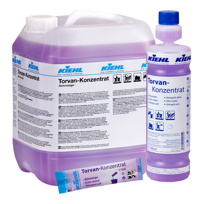 Ein Set von Johannes Kiehl KG Kiehl Torvan-Konzentrat Aktivreiniger besteht aus einem 5-Liter-Behälter, einer 1-Liter-Flasche und einem Beutel mit violetter Flüssigkeit und einer weißen Verpackung mit deutschem Etikett.