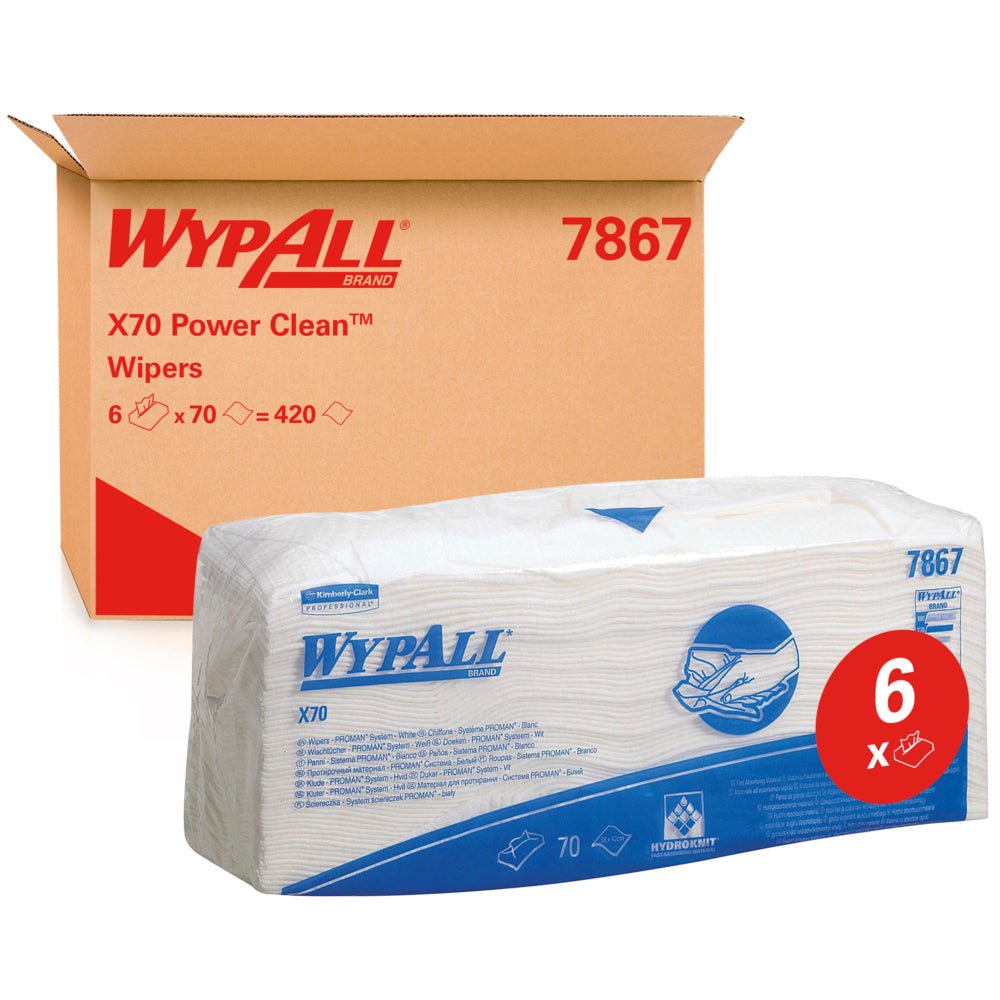 Uma embalagem de toalhetes WypAll® X70 - dobrados / Branco (6 sacos x 70 toalhetes) da Kimberly-Clark GmbH é mostrada em frente a uma caixa com a inscrição "WypAll 7867". A etiqueta vermelha "6x" destaca os toalhetes de limpeza de qualidade industrial com marcação azul.