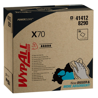 Uma caixa da Kimberly-Clark GmbH WypAll® X70 PowerClean Zupfbox/Azul (10 caixas x 100 folhas) mostra informações do produto, uma ilustração de mão azul-preto e o texto "Now BIGGER & MORE ABSORBENT!" para limpeza profissional.